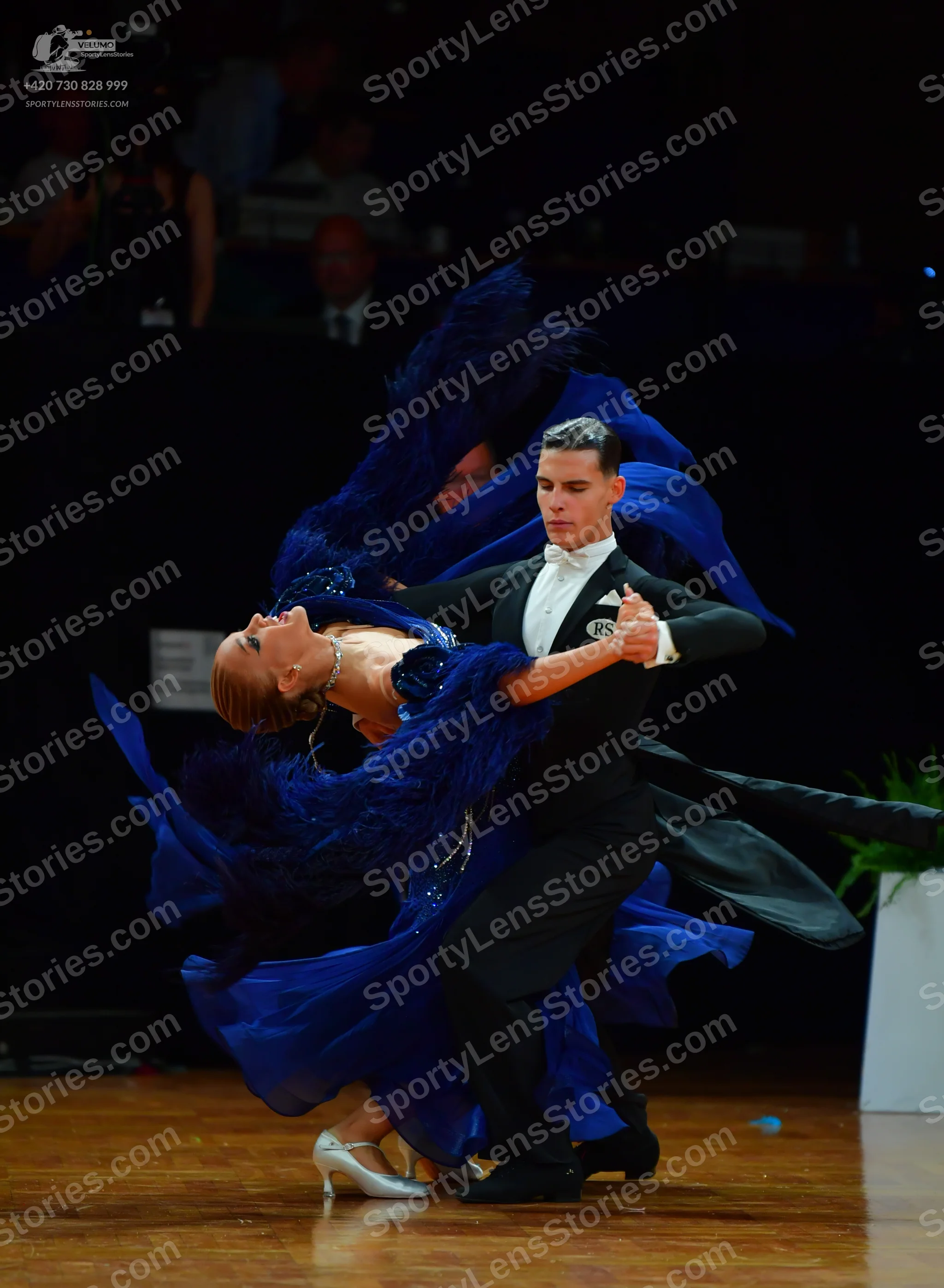 Dancesport competitor: Male**
*   **Color:** Black
*   **Fabric:** Sequins
*   **Style:** Tail suit wit
