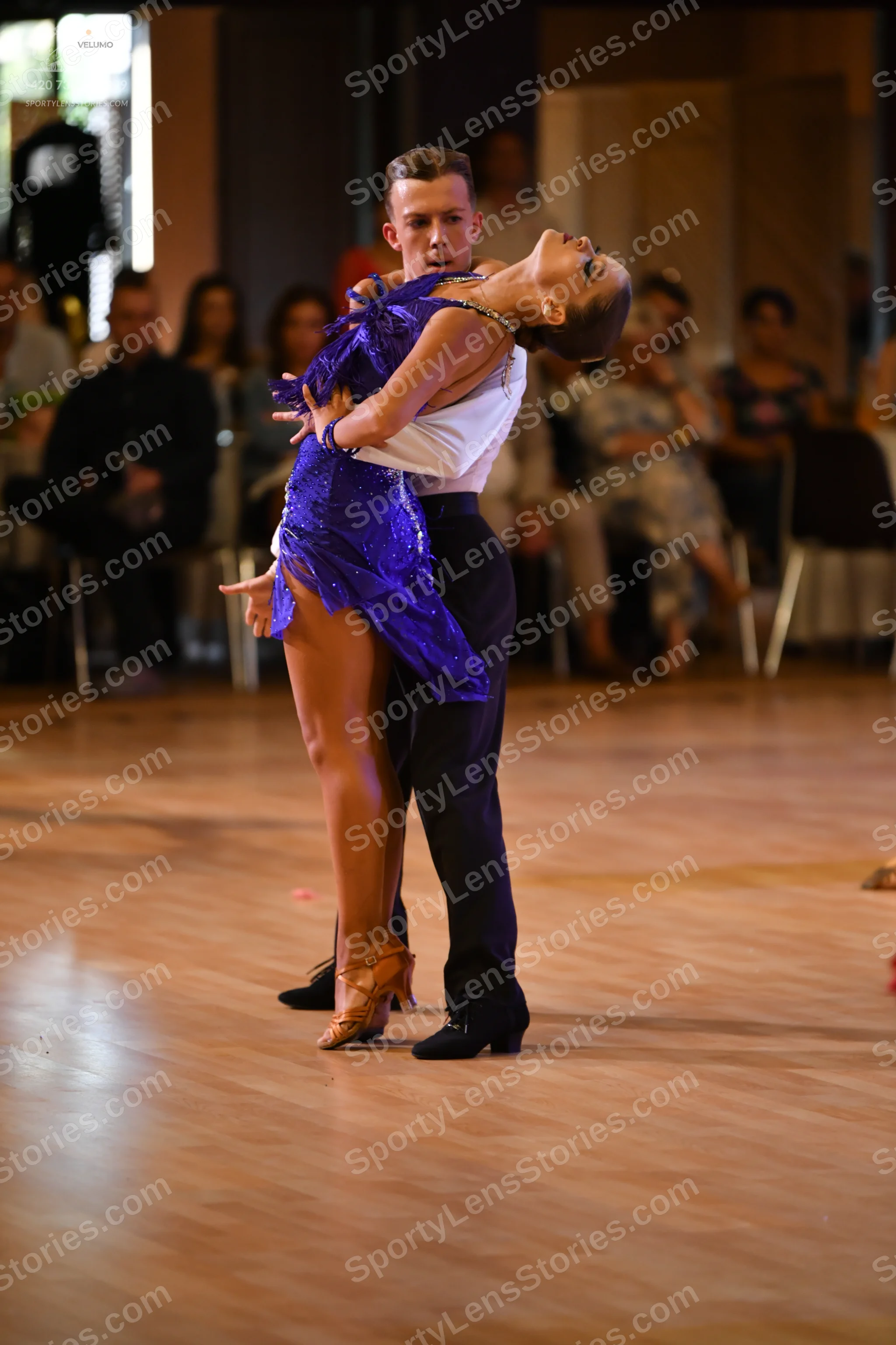 Dancesport competitor: ** Black tail suit
*   **Fabric:** Appears to be a satin fabric with sequins on 