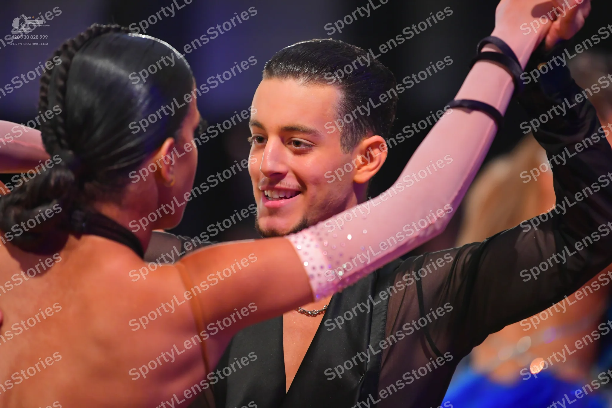 Dancesport competitor: Male dancer: black Latin dance shirt with a satin-like finish