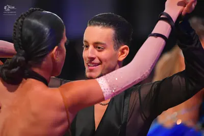 Dancesport competitor: Male dancer: black Latin dance shirt with a satin-like finish