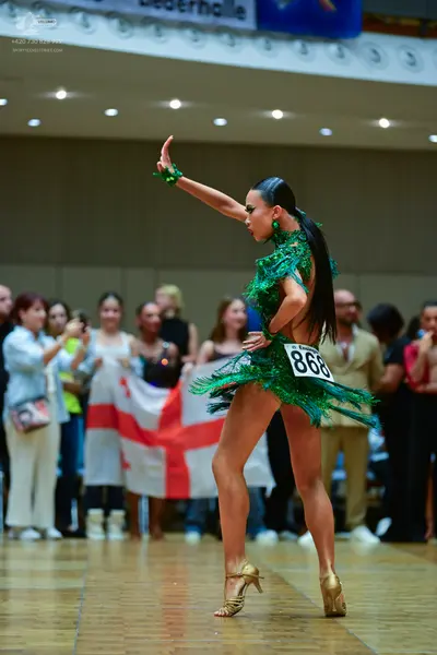Dancesport competitor #868: Female dancer: green latin dress with fringe