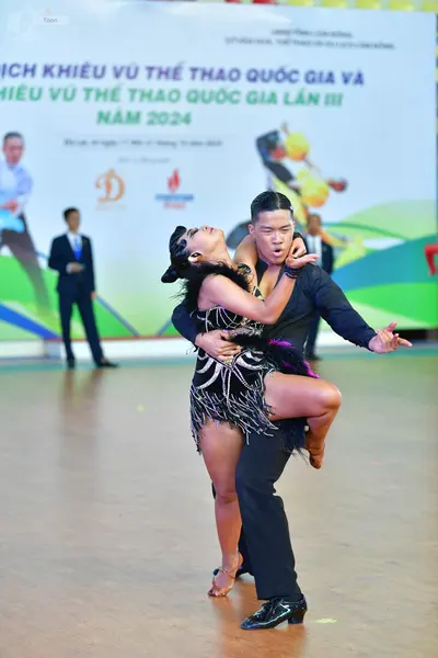 Dancesport competitor: ** Black suit with a satin jacket and trousers