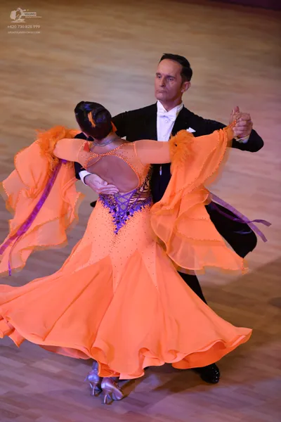 Dancesport competitor: ** Male:
*   **Color:** Black
*   **Fabric:** Sequin
*   **Style:** Tail suit wi