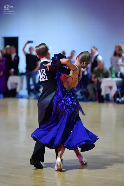 Dancesport competitor #138: Male dancer: black waistcoat over a white shirt and black trousers