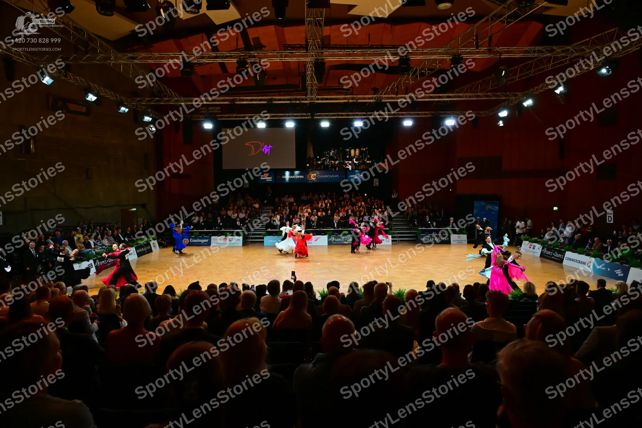 Dancesport competitor: Female dancers are wearing various colorful Latin dresses in shades of blue, red