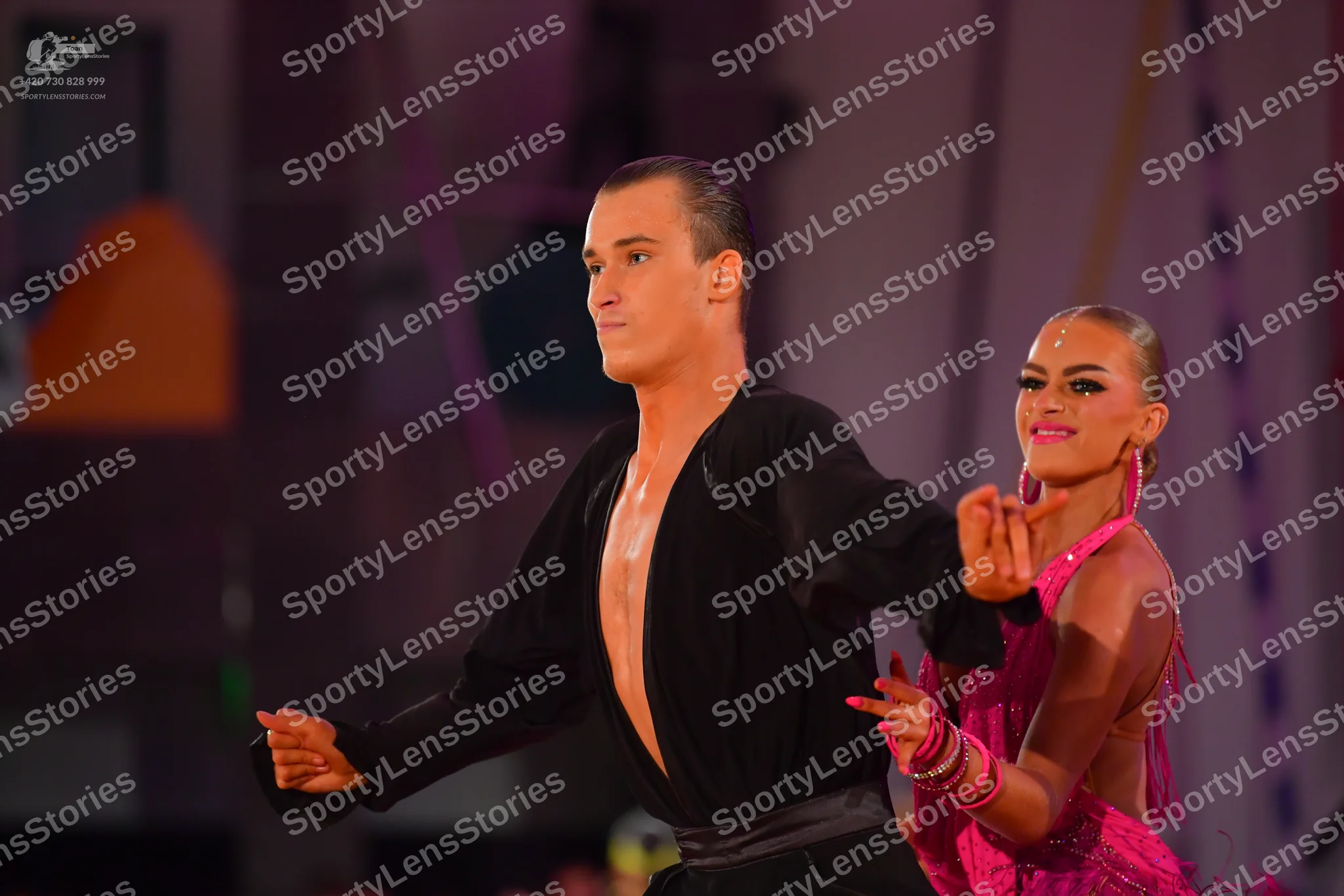 Dancesport competitor: Male dancer: black long-sleeved Latin shirt with an open front