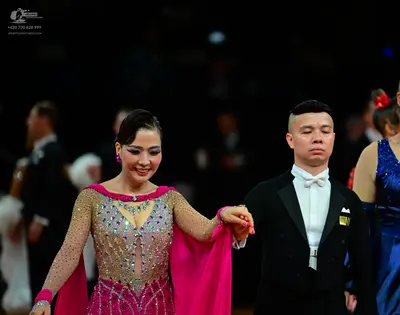 Dancesport competitor: Main female dancer: pink and nude Latin dress heavily embellished with silver se