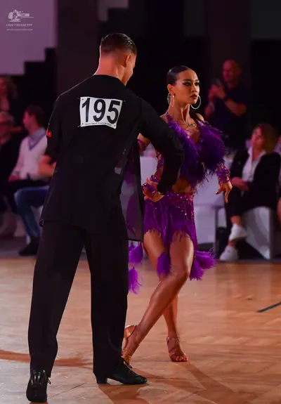 Dancesport competitor #195: Male dancer: black long-sleeved shirt and black trousers
