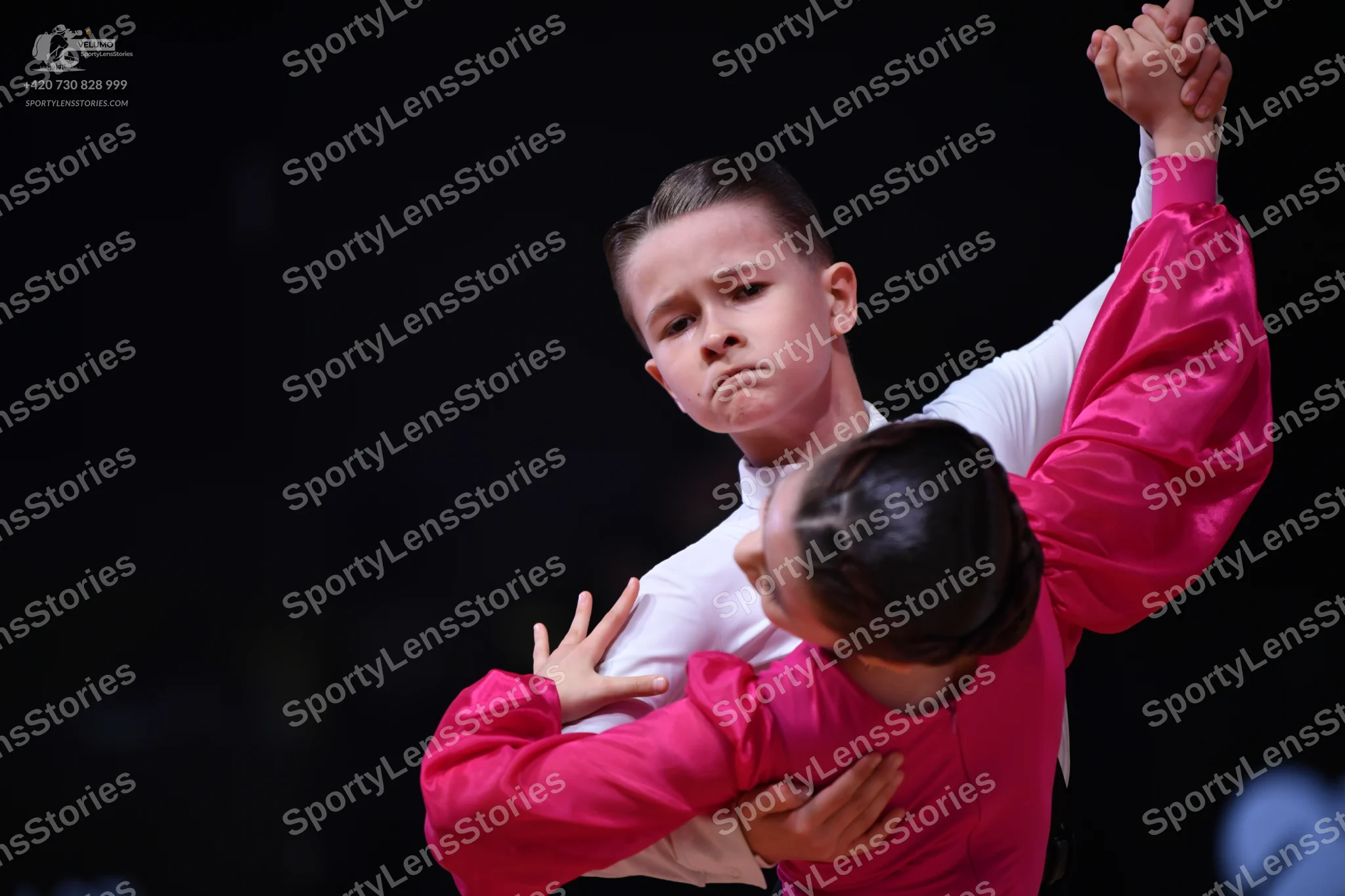 Dancesport competitor: Male dancer: white long-sleeved shirt and dark trousers