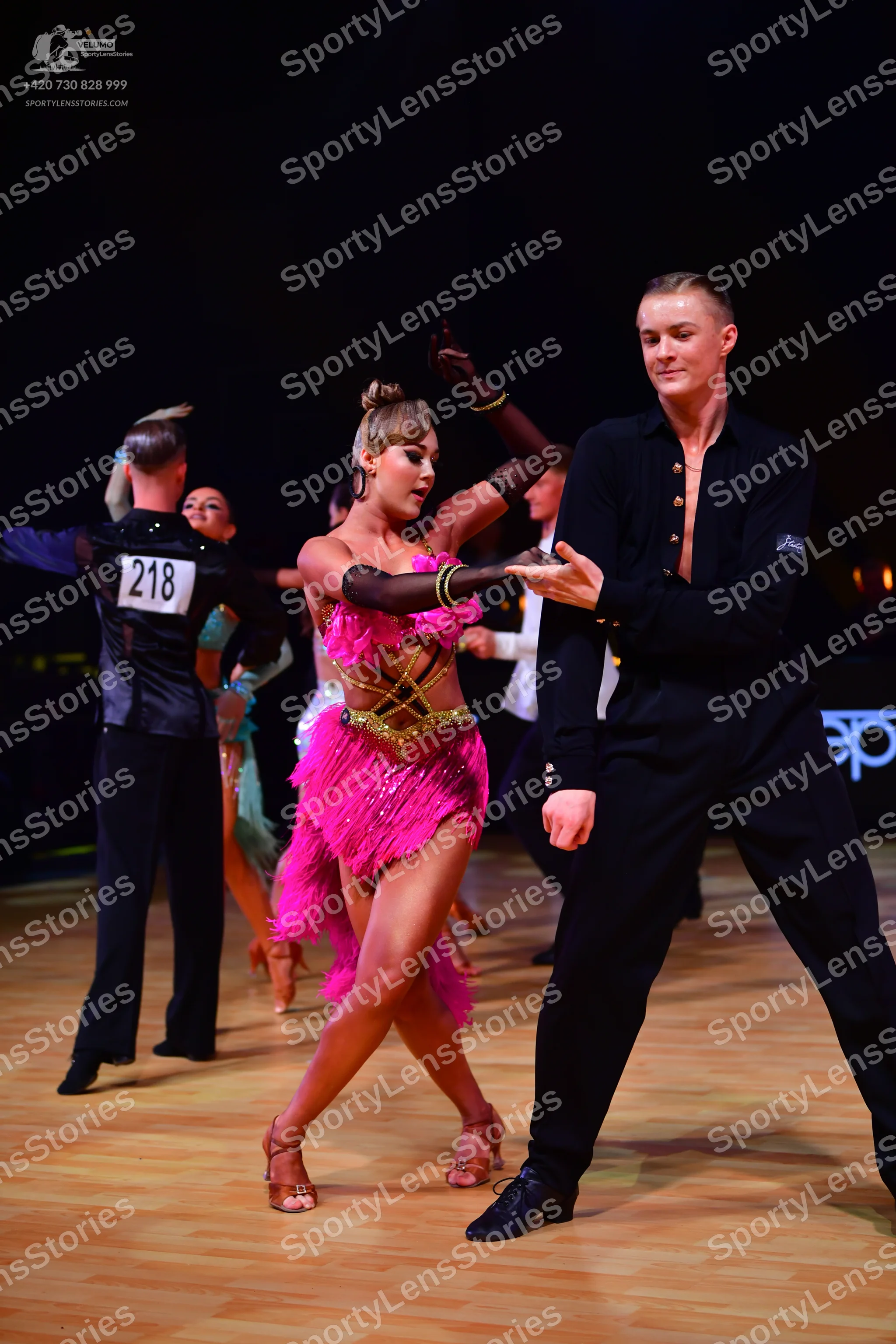 Dancesport competitor: Male dancer: black shirt and trousers