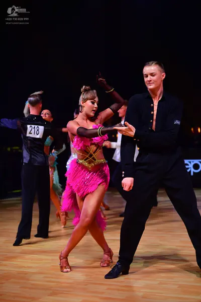 Dancesport competitor: Male dancer: black shirt and trousers