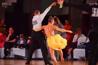 Dancesport competitor #286, #41: Male dancer: white long-sleeved shirt and black trousers