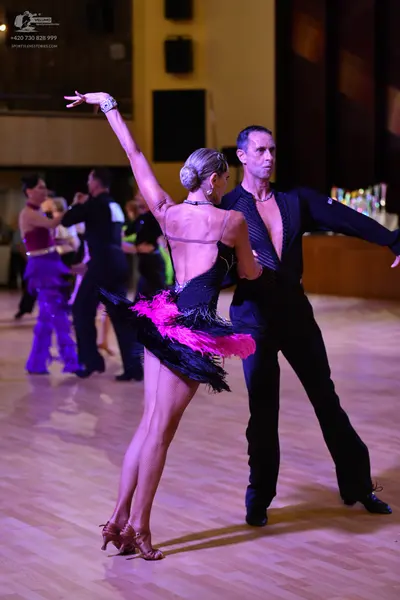 Dancesport competitor: ** Black tailsuit