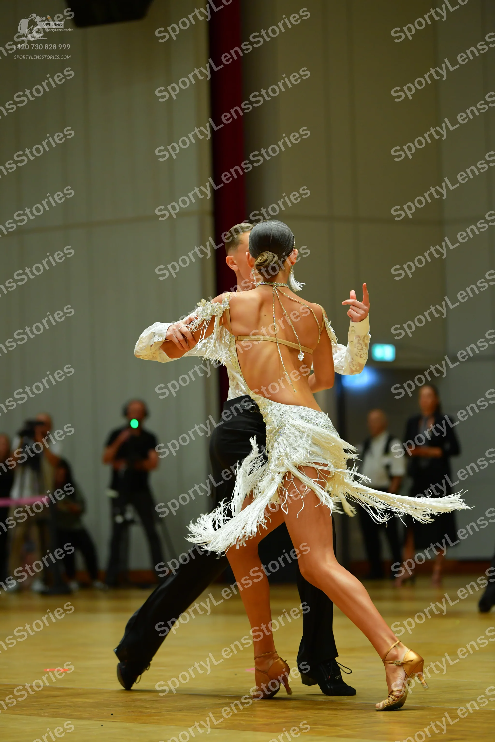 Dancesport competitor: Male dancer: white long-sleeved shirt and black trousers