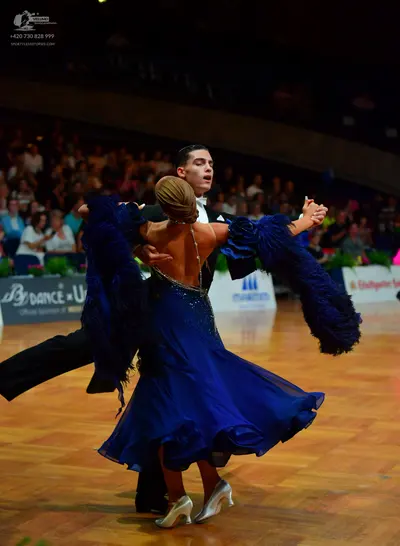 Dancesport competitor: Male dancer: black suit
