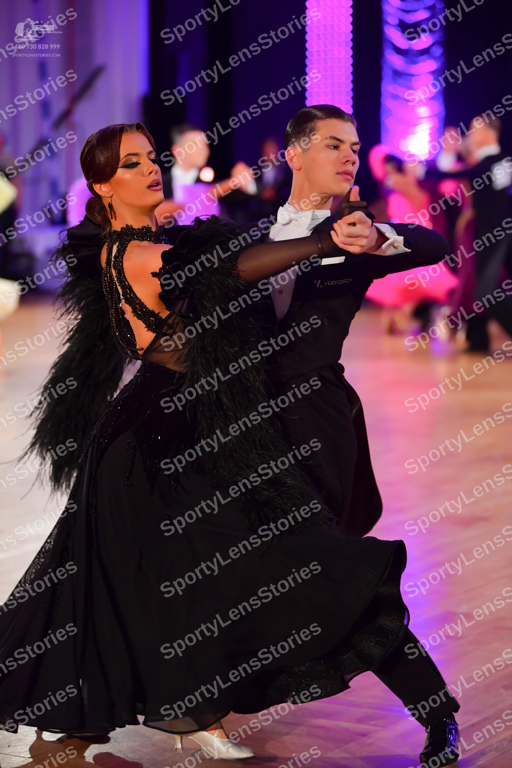 Dancesport competitor: Male dancer: black formal suit with a white shirt