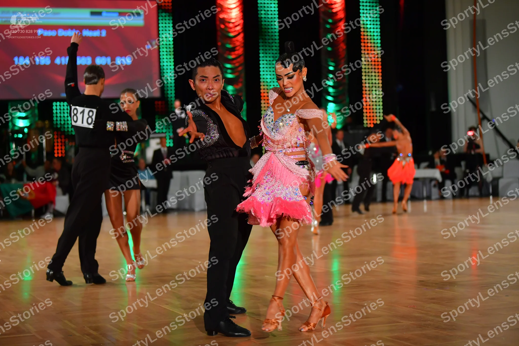 Dancesport competitor #818: Male dancer (left): black long-sleeved top and trousers
