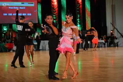 Dancesport competitor #818: Male dancer (left): black long-sleeved top and trousers