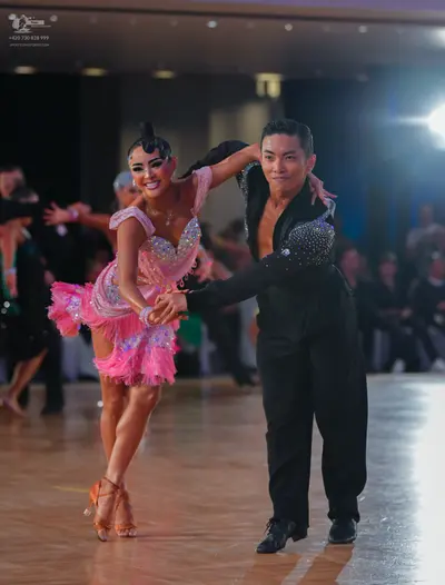Dancesport competitor: Male dancer: black long-sleeved shirt with sequins on the upper chest and black 