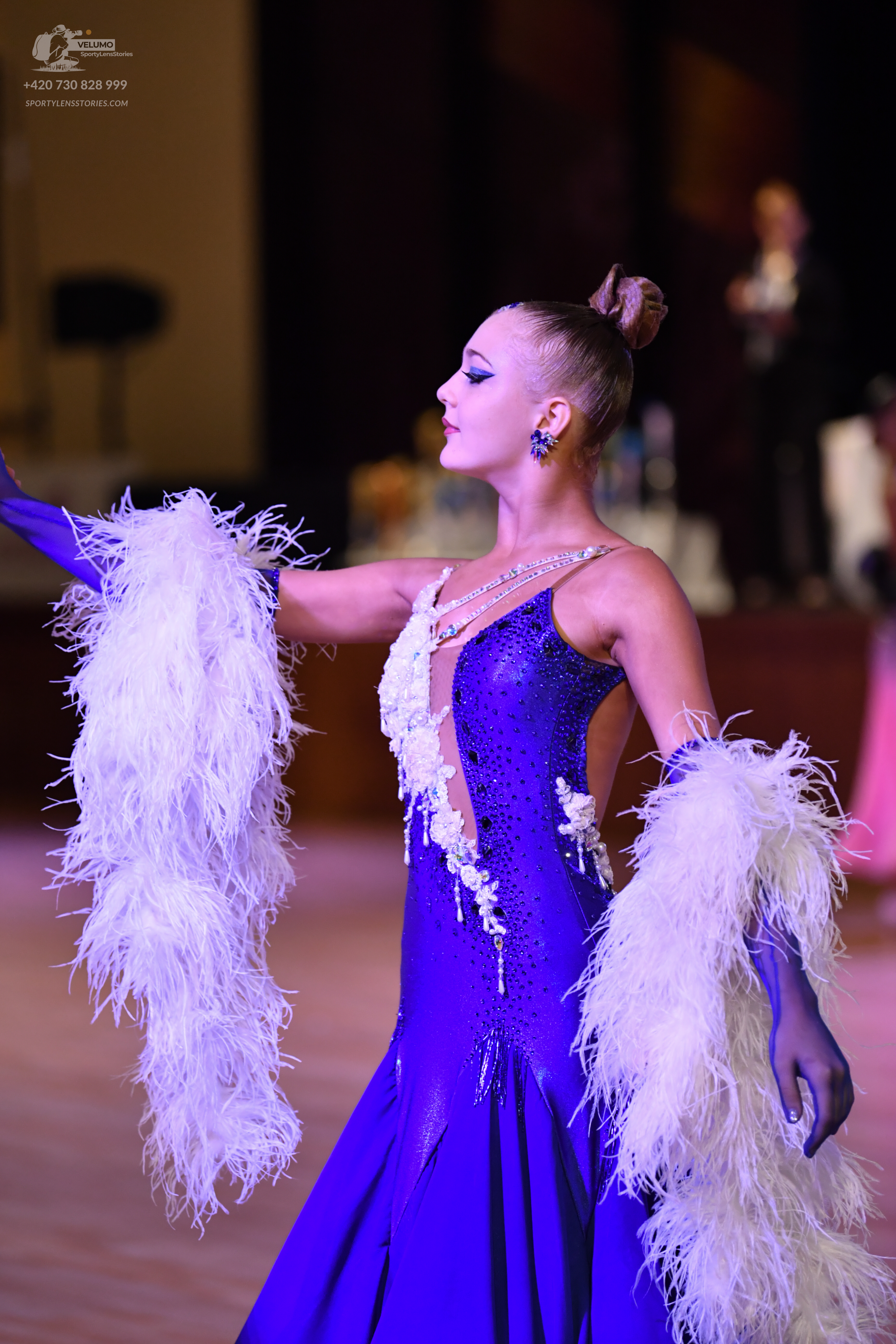 Dancesport competitor: Female:**  Deep purple, shimmering, floor-length gown