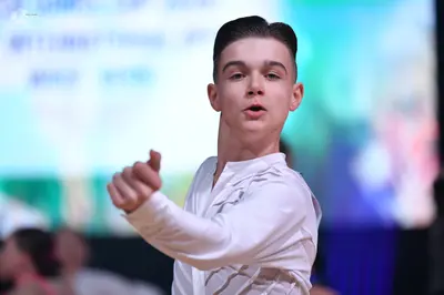 Dancesport competitor: Male dancer: white long-sleeved shirt