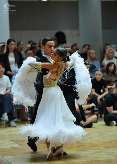 Dancesport competitor: Male dancer: black suit