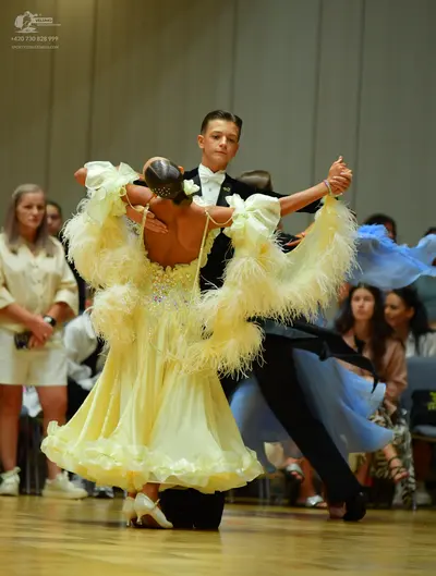Dancesport competitor: Male dancer: black suit with a white shirt