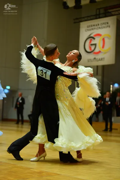 Dancesport competitor: Male dancer: black long-sleeved top and black trousers