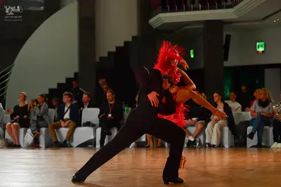 Dancesport competitor: Male dancer: black suit