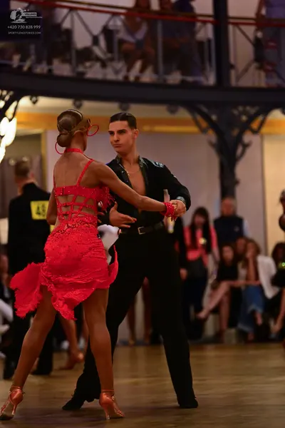 Dancesport competitor: Female dancer: red lace latin dress