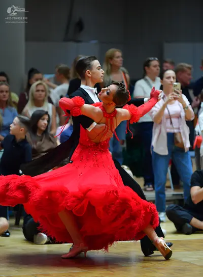 Dancesport competitor: Male dancer: black suit, white shirt, and white bow tie