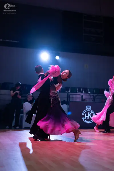 Dancesport competitor: Male dancer: black ballroom suit and white shirt