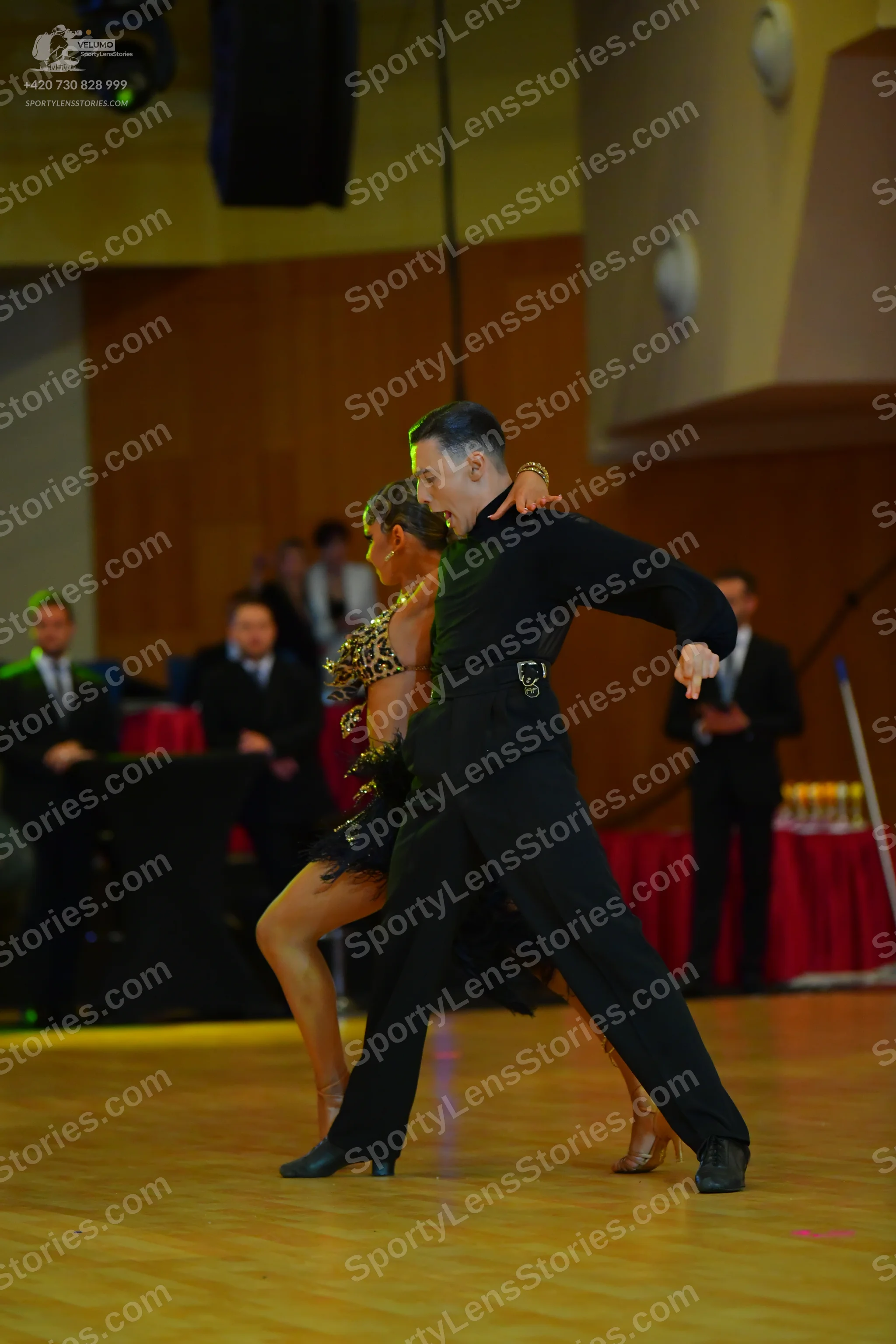 Dancesport competitor: Male dancer: black long-sleeved shirt and black trousers