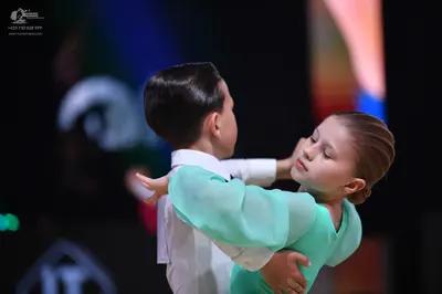 Dancesport competitor: Male dancer: white long-sleeved shirt