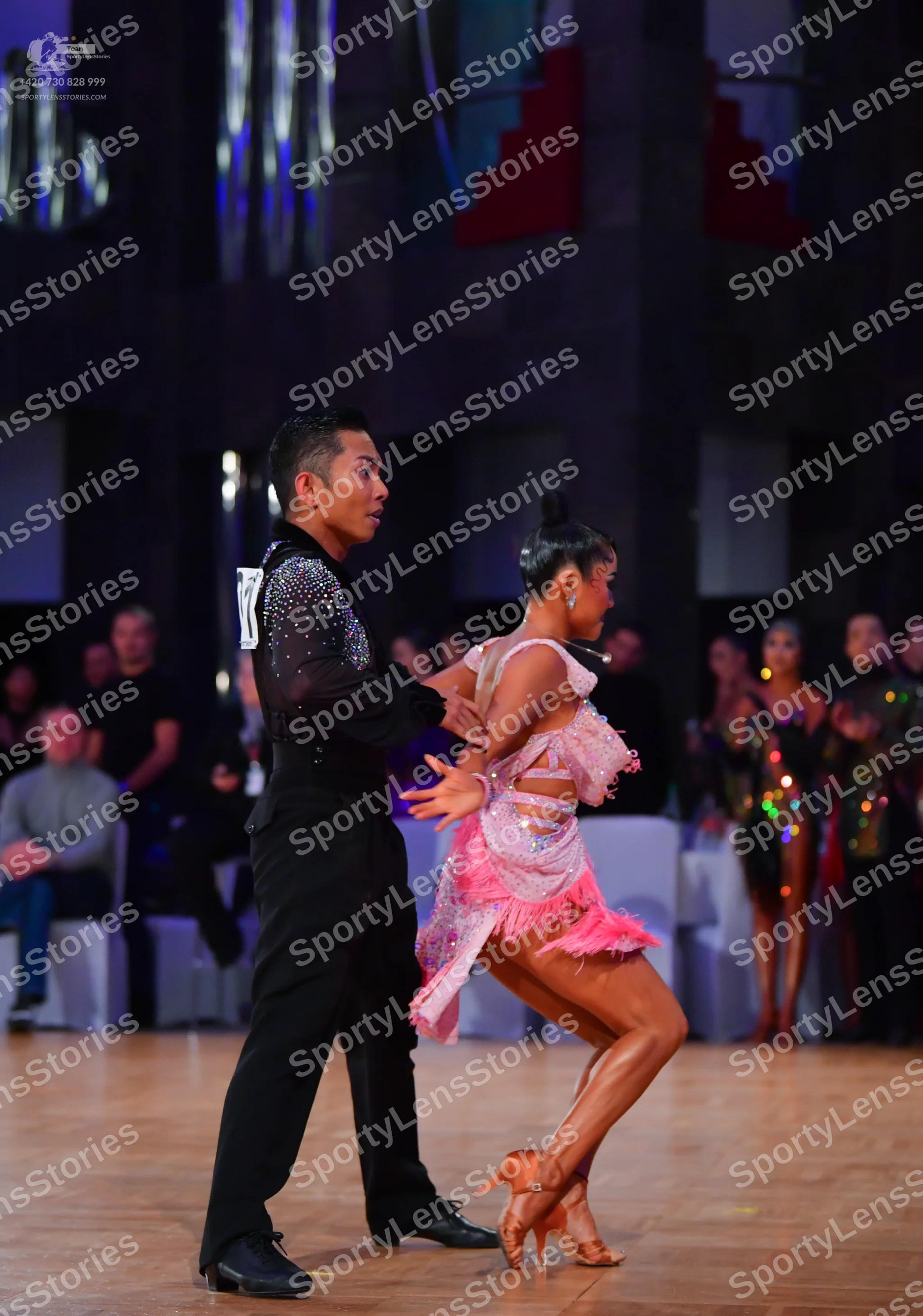 Dancesport competitor: Male dancer: black long-sleeved shirt with sequins on the chest and shoulders, b