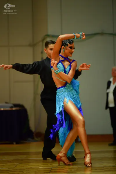 Dancesport competitor: Male dancer: black long-sleeved shirt and black trousers