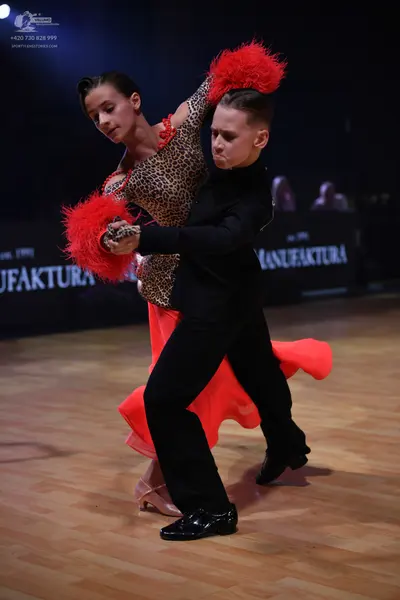 Dancesport competitor: Male dancer: black long-sleeved dance shirt and black trousers