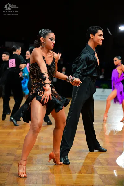 Dancesport competitor #78: Male dancer: black long-sleeved shirt and black trousers