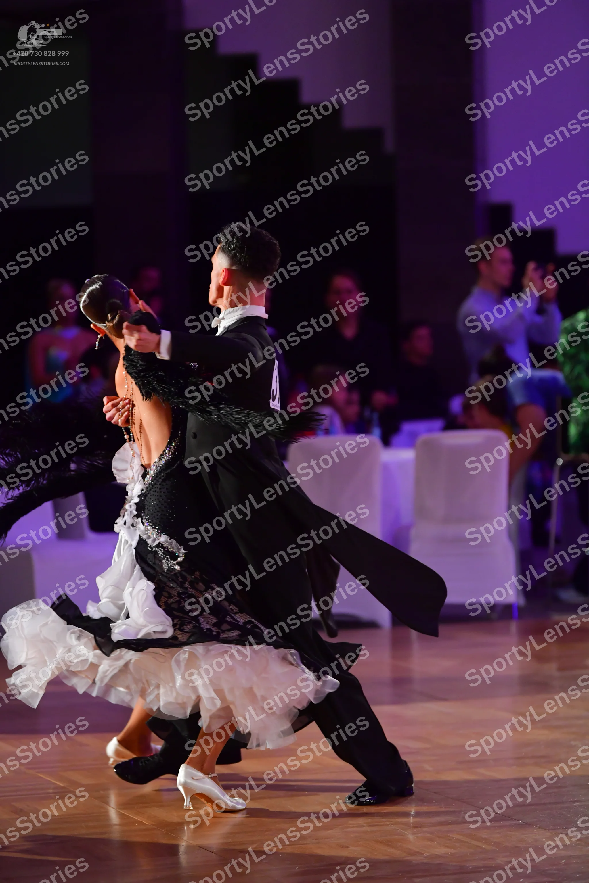 Dancesport competitor: Male dancer: black tailcoat, white shirt, black bow tie, and black trousers