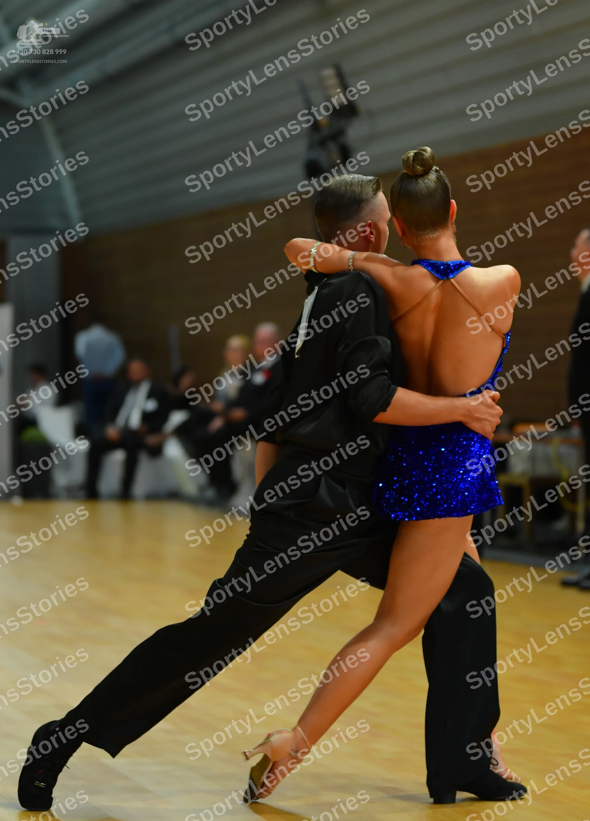 Dancesport competitor: Male**

*   **Color:** Dark blue/navy
*   **Fabric:** Sequins (primarily) with p