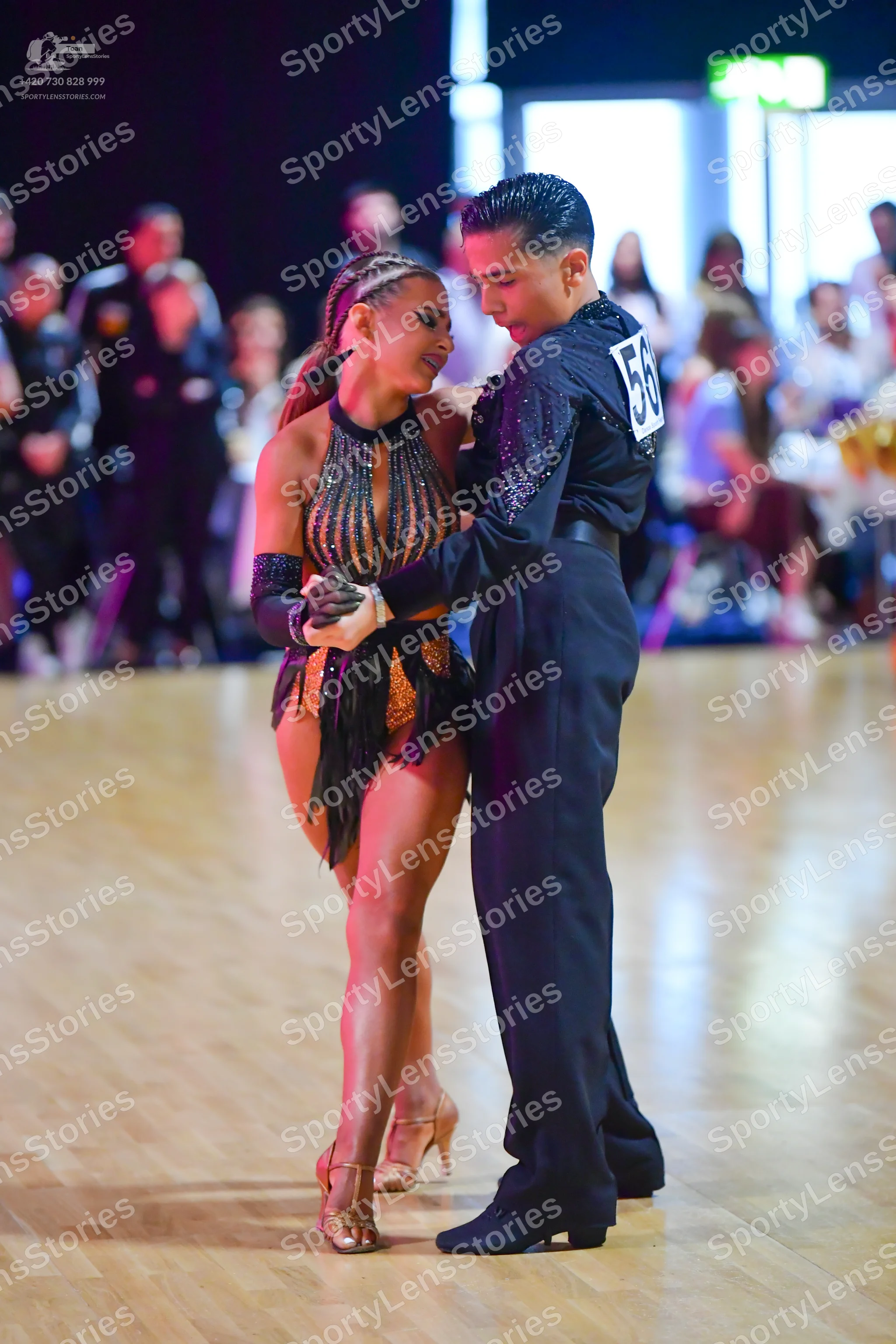 Dancesport competitor #56: Male dancer: black long-sleeved shirt with small shimmering embellishments and b