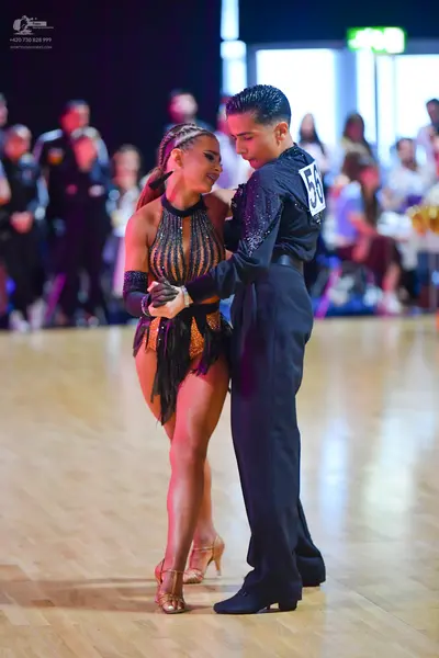 Dancesport competitor #56: Male dancer: black long-sleeved shirt with small shimmering embellishments and b