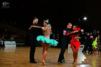 Dancesport competitor #93, #86: First male dancer: black long-sleeved shirt and trousers