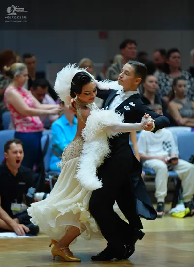 Dancesport competitor #145: Male dancer: black formal dance suit with a white shirt and white bowtie