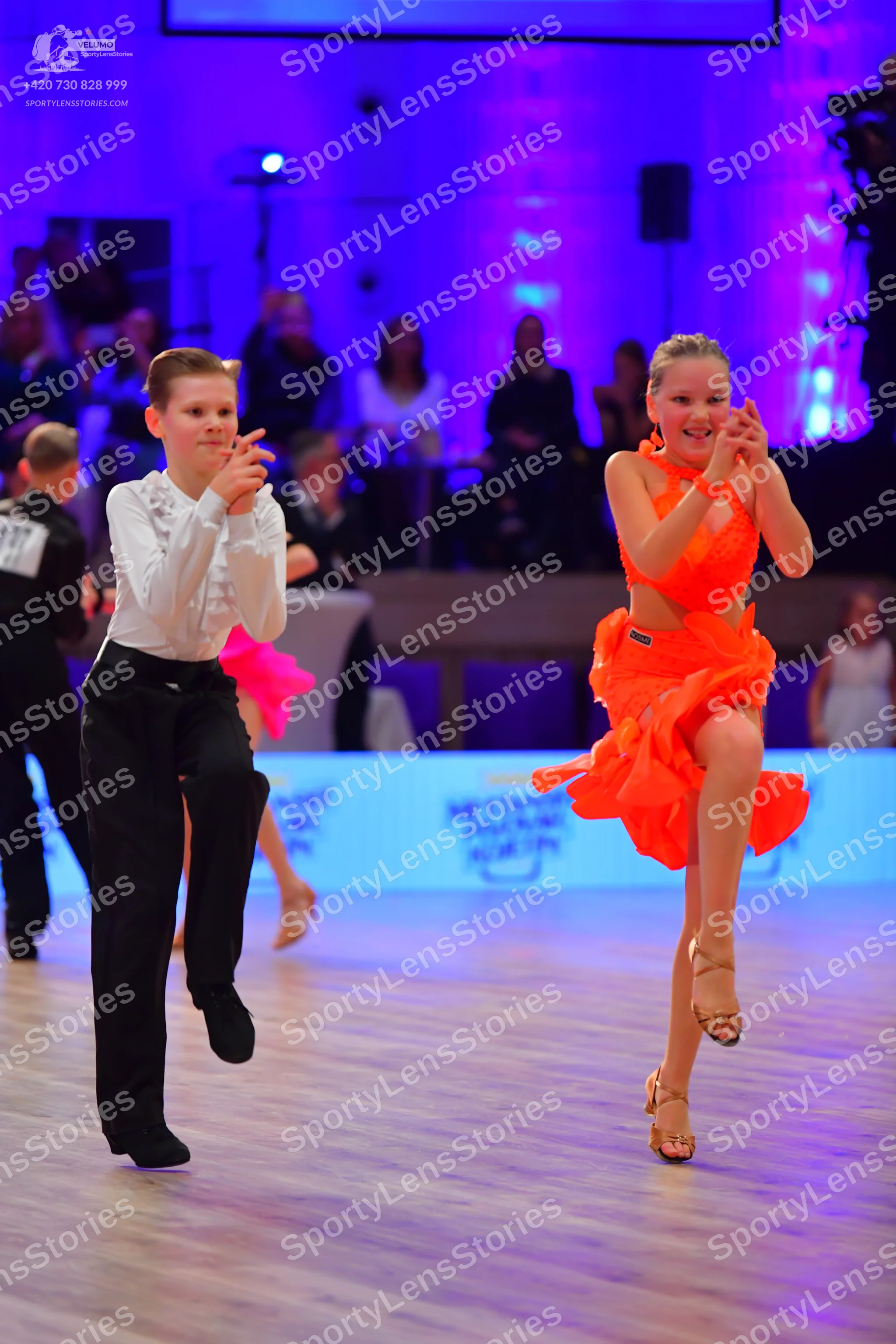 Dancesport competitor: Male dancer: white long-sleeved shirt and black trousers