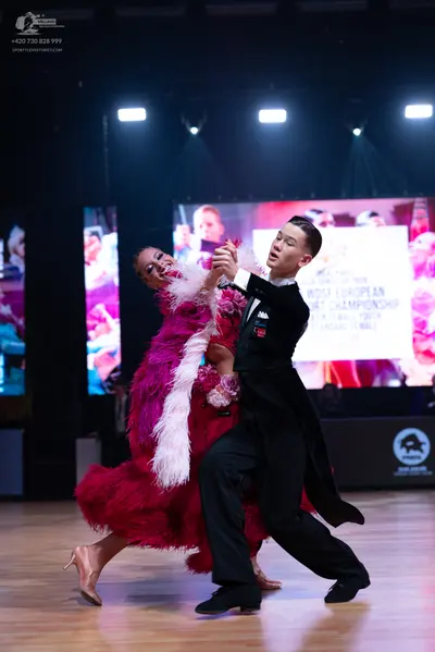 Dancesport competitor: Male dancer: black suit