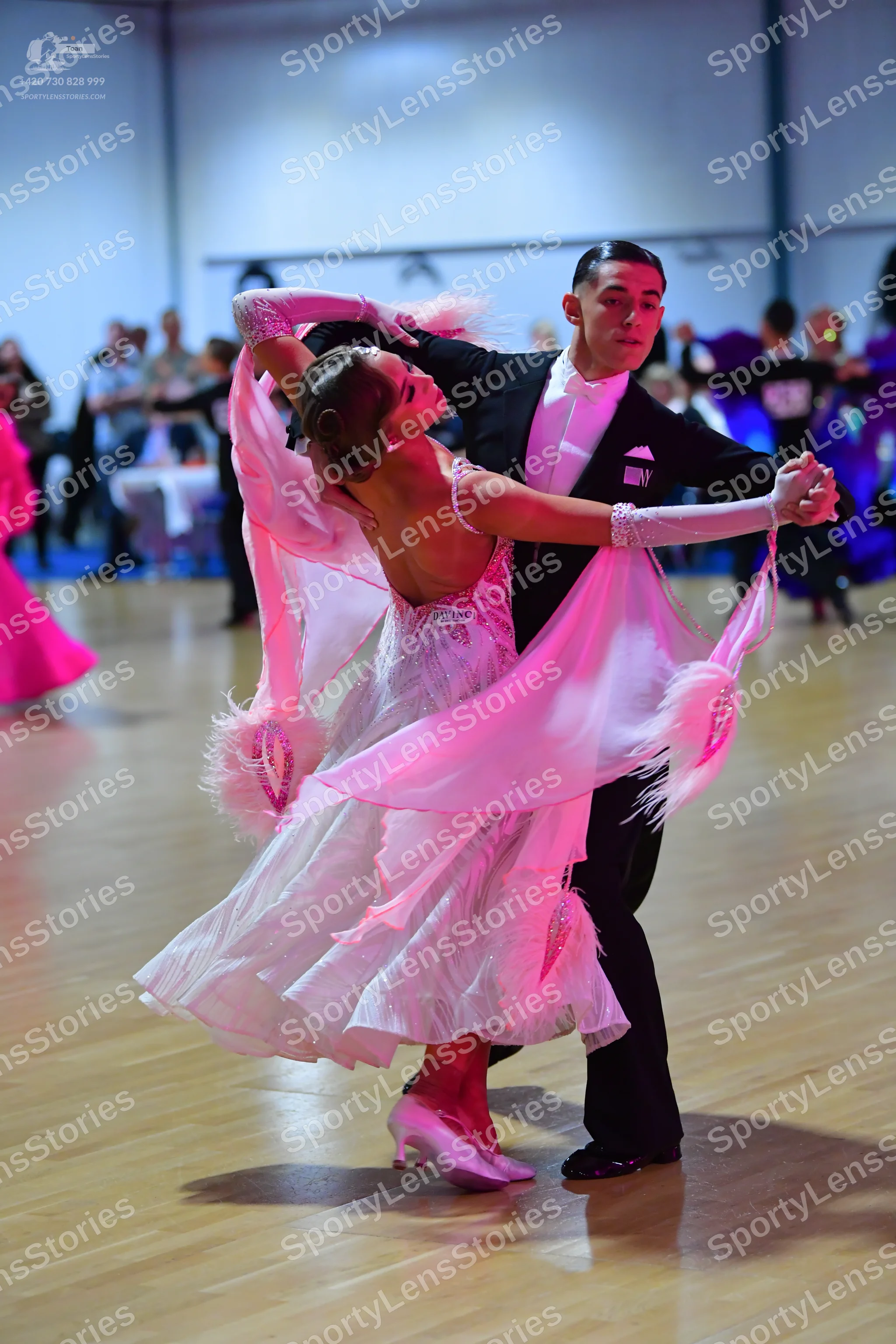 Dancesport competitor: Male dancer: black suit with a white shirt and black trousers