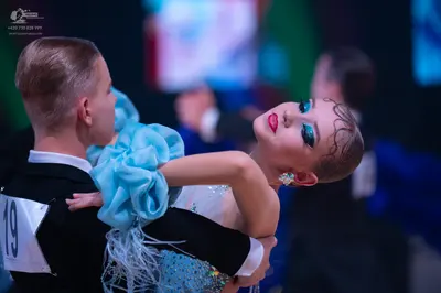 Dancesport competitor: Male dancer: black suit with a white shirt
