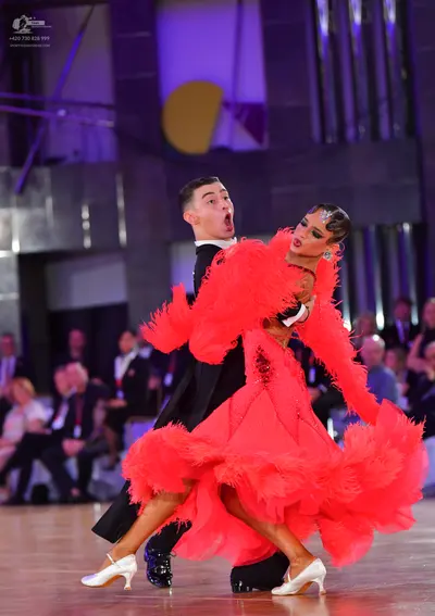 Dancesport competitor: Male dancer: black suit with white shirt and black bowtie