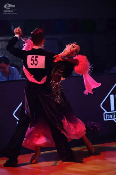 Dancesport competitor: Male dancer: black long-sleeved shirt and black trousers